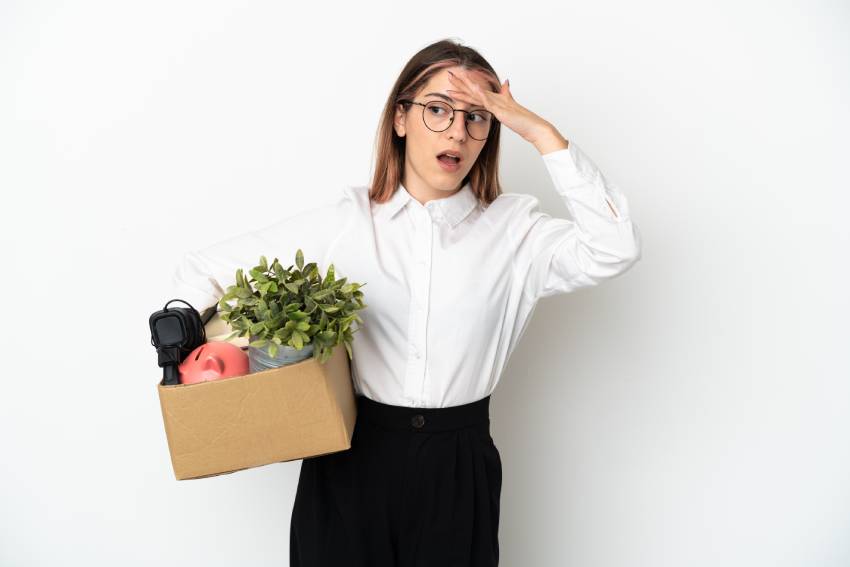 Woman with moving box remembering something she forgot