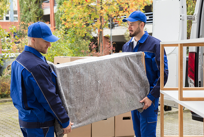 two movers moving the boxes away