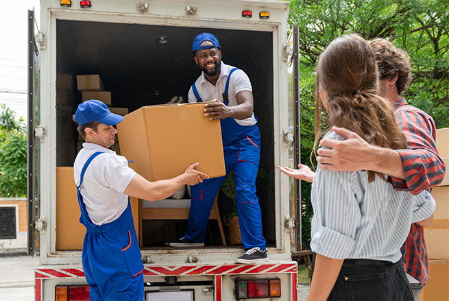 happy movers helping a couple move