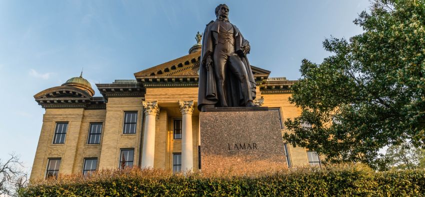 Richmond, TX - March 10, 2018 A staue of Mirabeau B Lamar, the 2nd president of TX stands in front of the historical courthouse in Fort Bend County