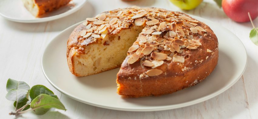 apple cake (apple apfel kuchen), fresh apples on a wooden background.